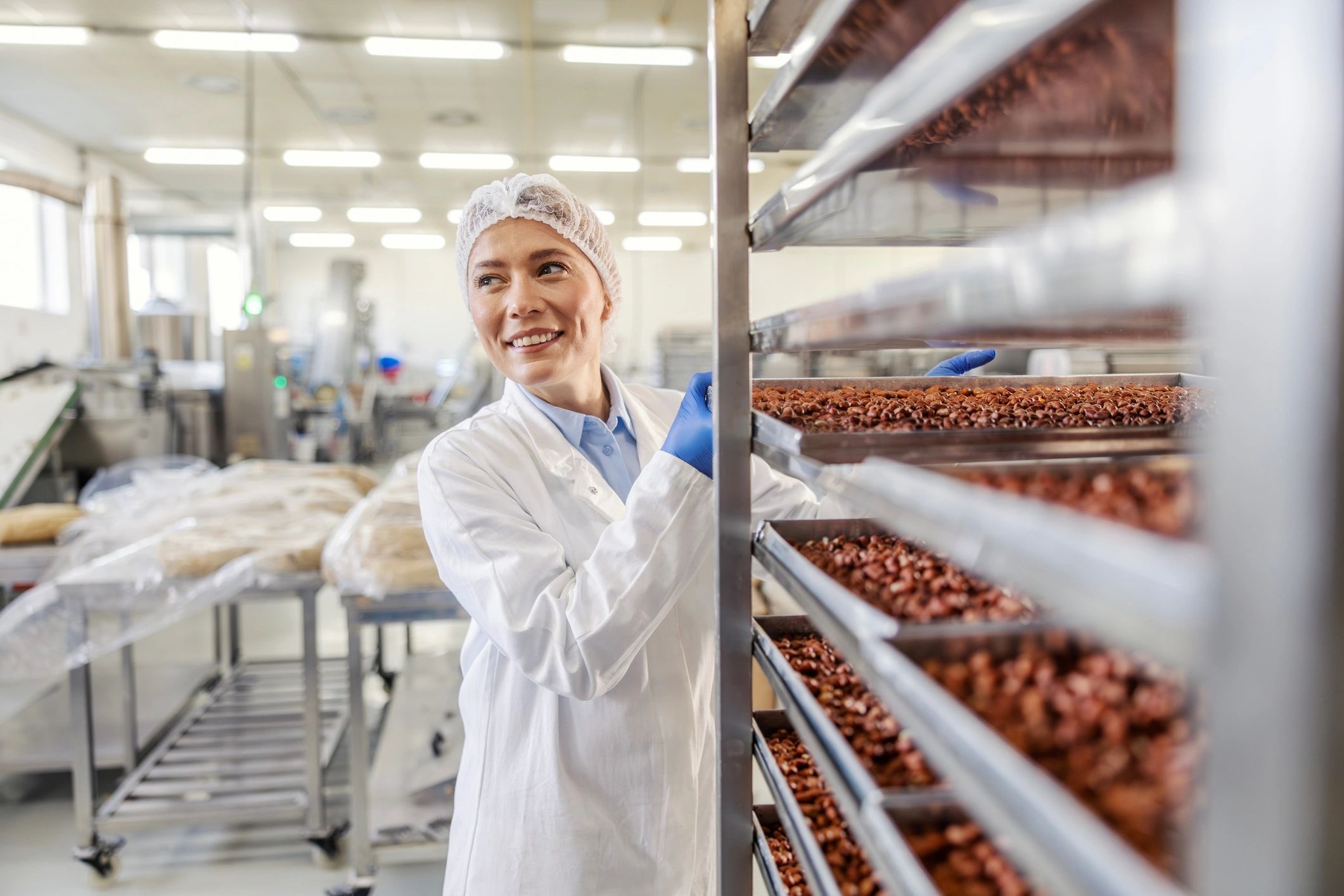 Food quality control professional inspecting products in a processing facility
